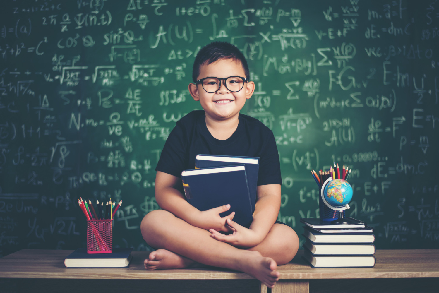 child sitting in Classroom with smile