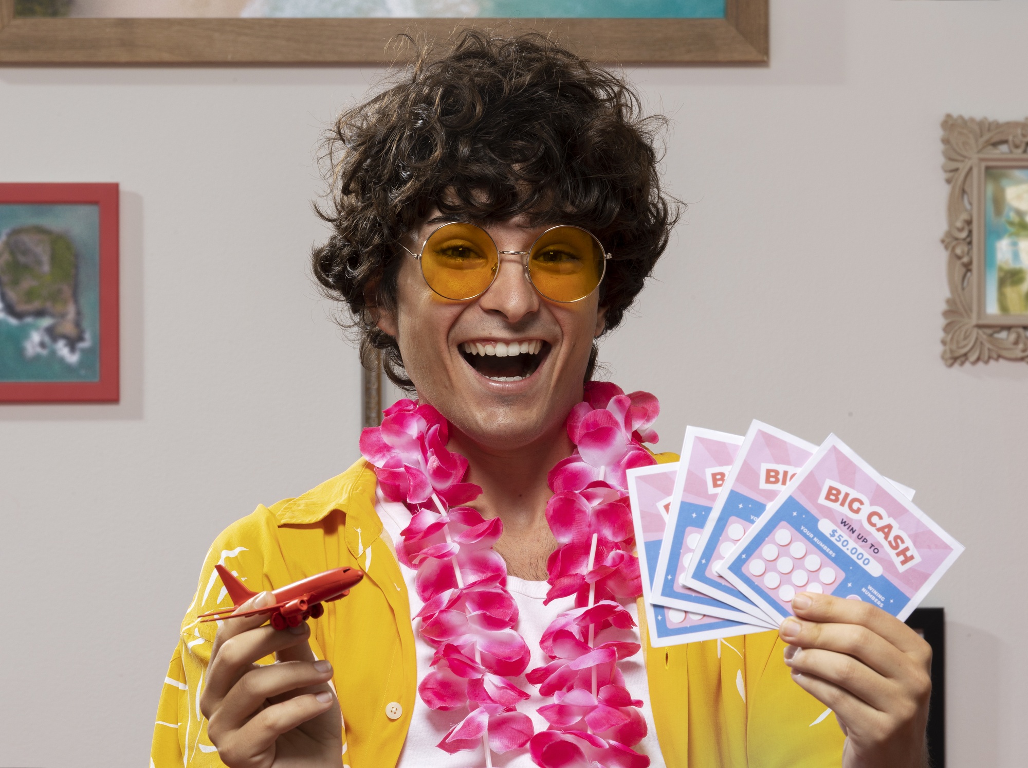 front view smiley man holding lottery tickets