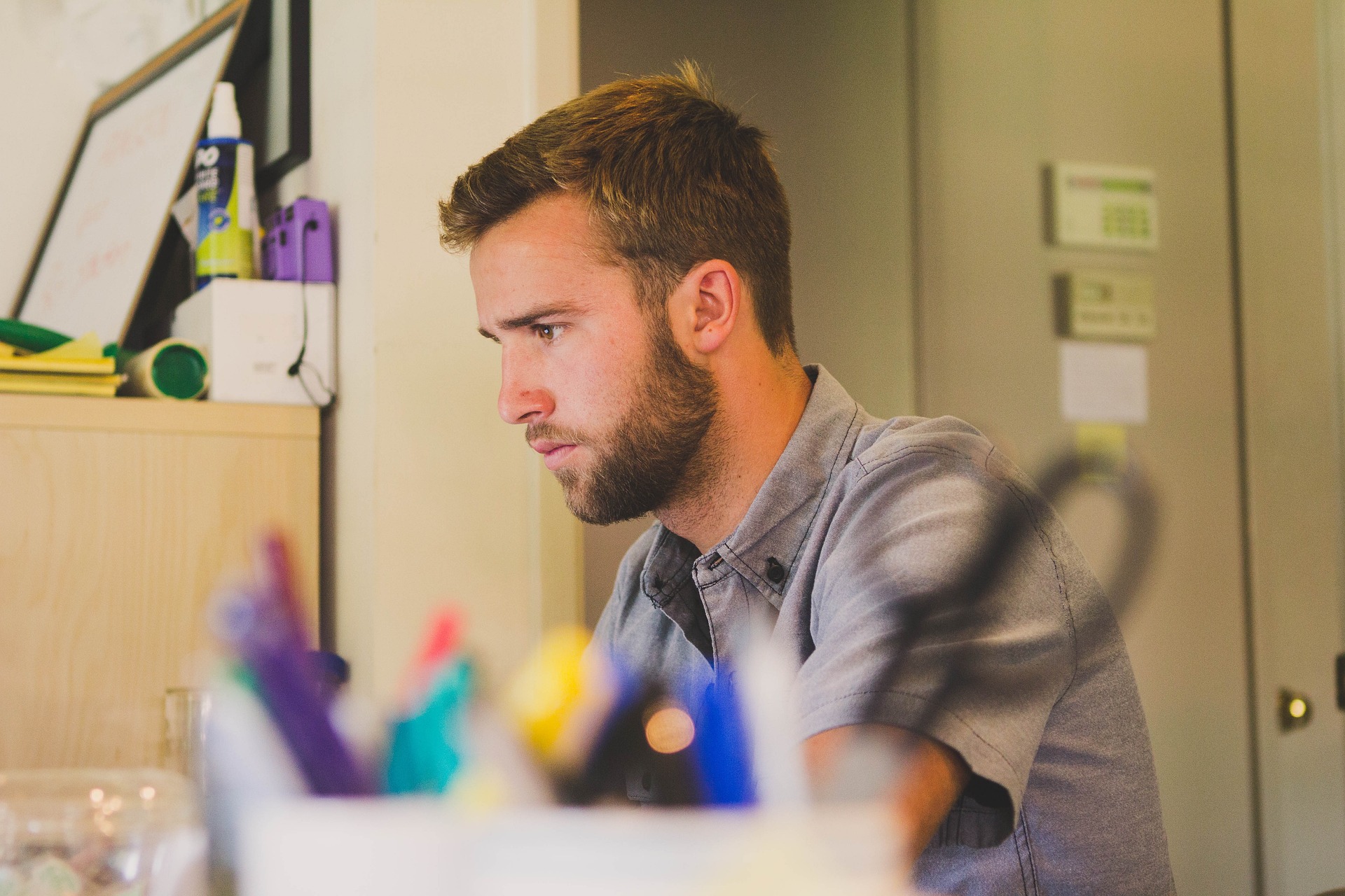Image of person sitting beside Laptop
